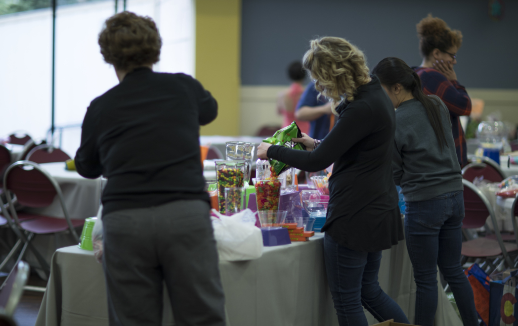 Volunteers staffing a registration table at an event