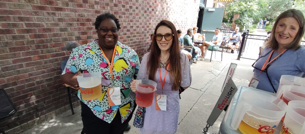 Volunteers carrying drinks for performers
